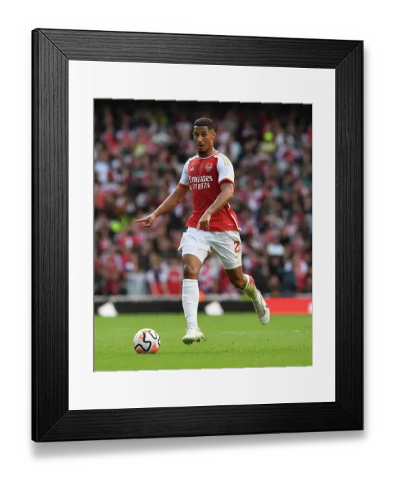 Framed Print : Arsenal's William Saliba Faces Off Against Tottenham in the 2023-24 Premier League Clash