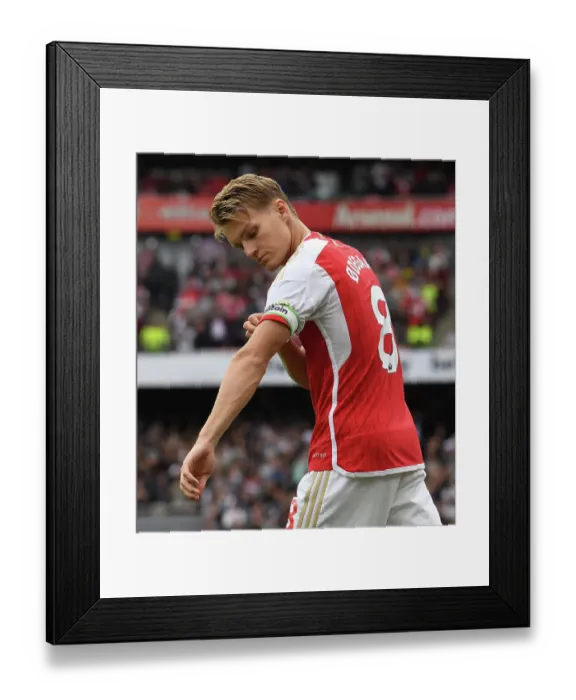 Framed Print : Martin Odegaard Faces Off Against Tottenham in Intense 2023-24 Premier League Showdown