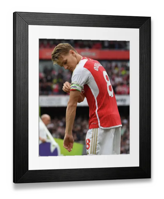 Framed Print : Arsenal's Martin Odegaard Faces Off Against Tottenham in the 2023-24 Premier League Showdown at Emirates Stadium