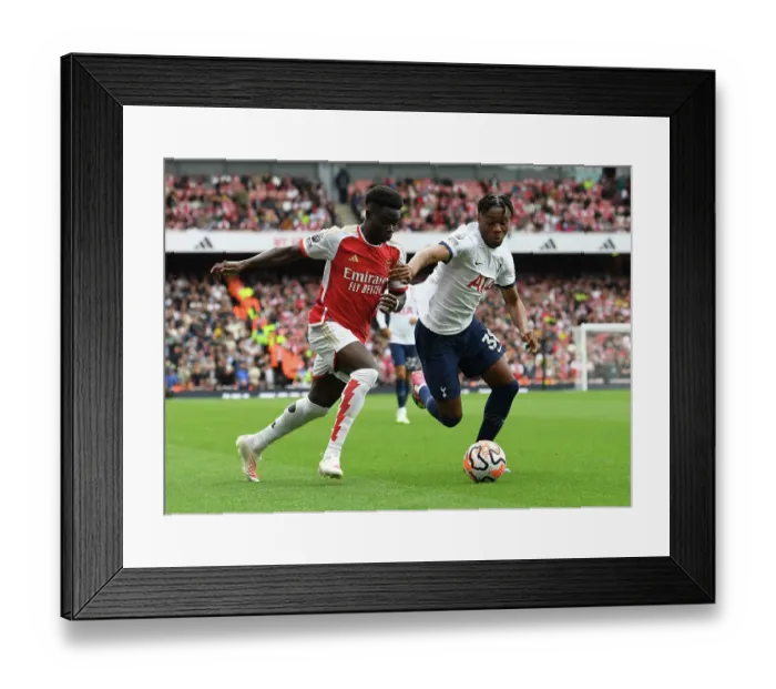 Framed Print : Saka vs. Udogie: Intense Rivalry Unfolds - Arsenal's Bukayo Saka Clashes with Tottenham's Destiny Udogie in the 2023-24 Premier League Showdown at Emirates Stadium Framed Print : Saka vs. Udogie: Intense Rivalry Unfolds - Arsenal's Bukayo Saka Clashes with Tottenham's Destiny Udogie in the 2023-24 Premier League Showdown at Emirates Stadium