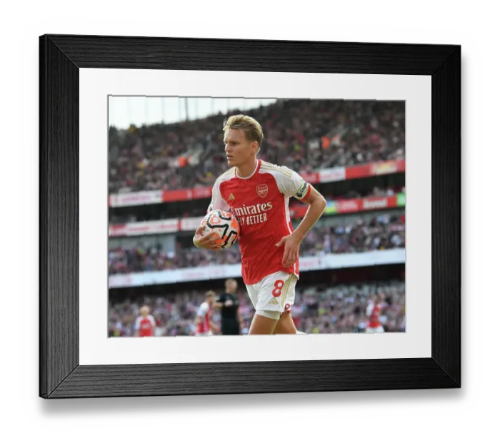 Framed Print : Arsenal's Martin Odegaard Faces Off Against Tottenham in the 2023-24 Premier League Clash at Emirates Stadium