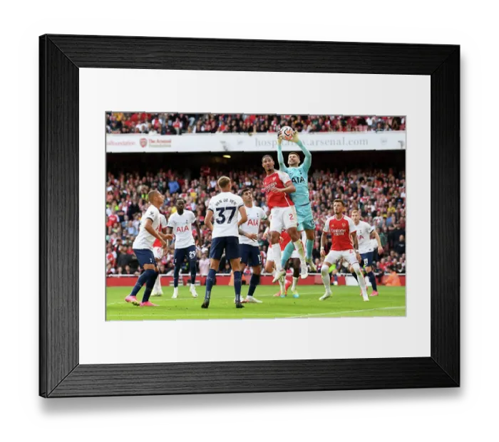 Framed Print : Arsenal vs. Tottenham: Saliba Leaps for Supremacy in the 2023-24 Premier League Clash