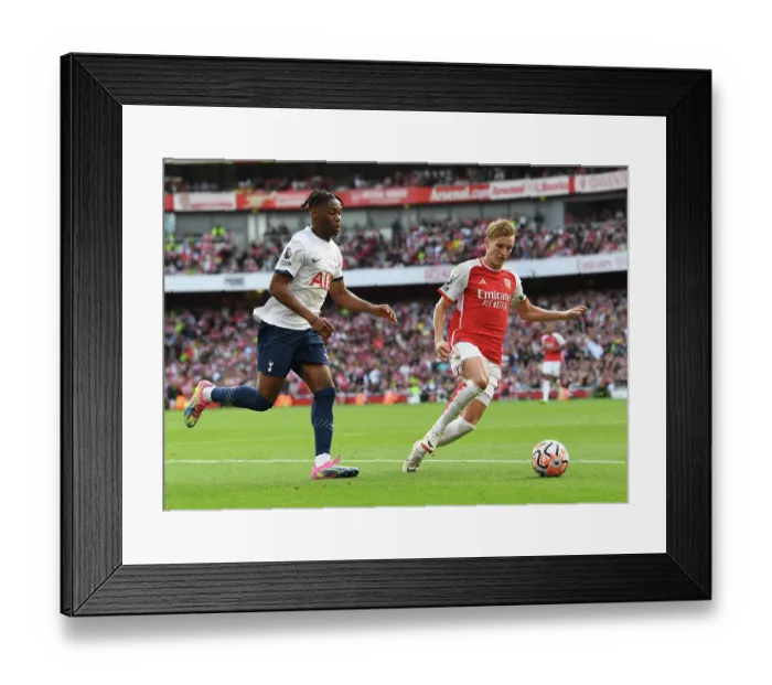 Framed Print : Arsenal vs. Tottenham Clash: Martin Odegaard vs. Destiny Udogie at Emirates Stadium (2023-24) Framed Print : Arsenal vs. Tottenham Clash: Martin Odegaard vs. Destiny Udogie at Emirates Stadium (2023-24)