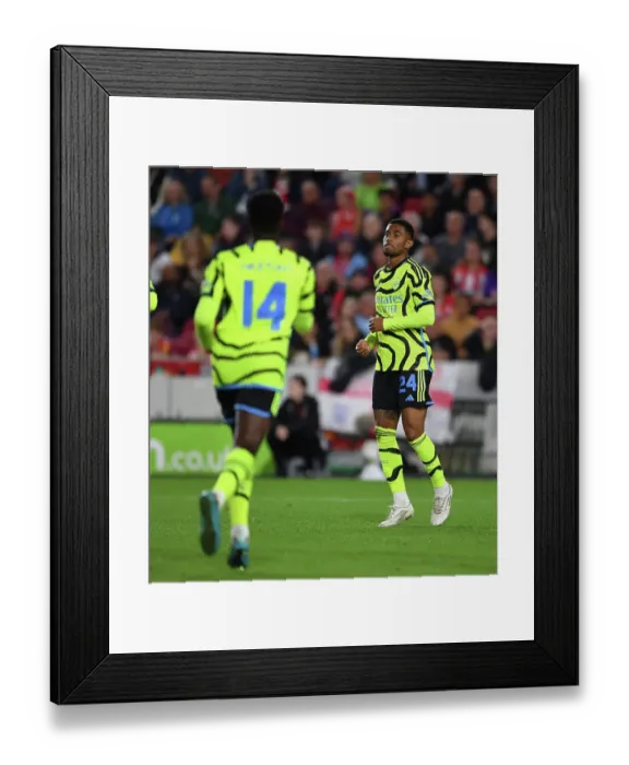 Framed Print : Reiss Nelson Scores the Winning Goal: Arsenal Advances in Carabao Cup Against Brentford