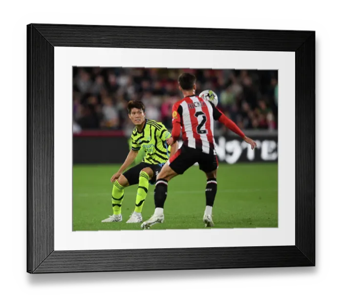 Framed Print : Brentford vs Arsenal: Tomiyasu Closes In on Hickey in Carabao Cup Clash Framed Print : Brentford vs Arsenal: Tomiyasu Closes In on Hickey in Carabao Cup Clash