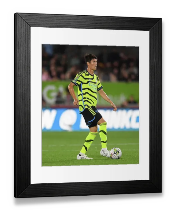 Framed Print : Arsenal's Tomiyasu in Action against Brentford in Carabao Cup Clash