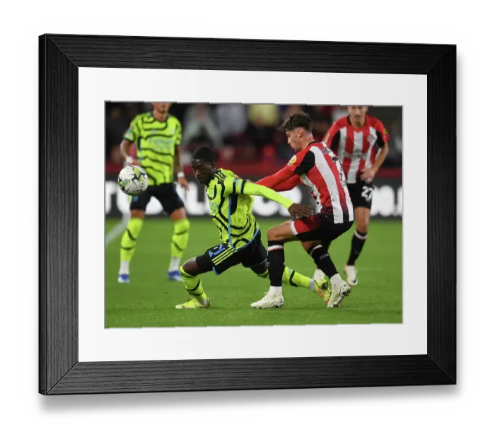 Framed Print : Brentford vs Arsenal: Carabao Cup Clash - Charles Sagoe Jr vs Aaron Hickey Battle Framed Print : Brentford vs Arsenal: Carabao Cup Clash - Charles Sagoe Jr vs Aaron Hickey Battle
