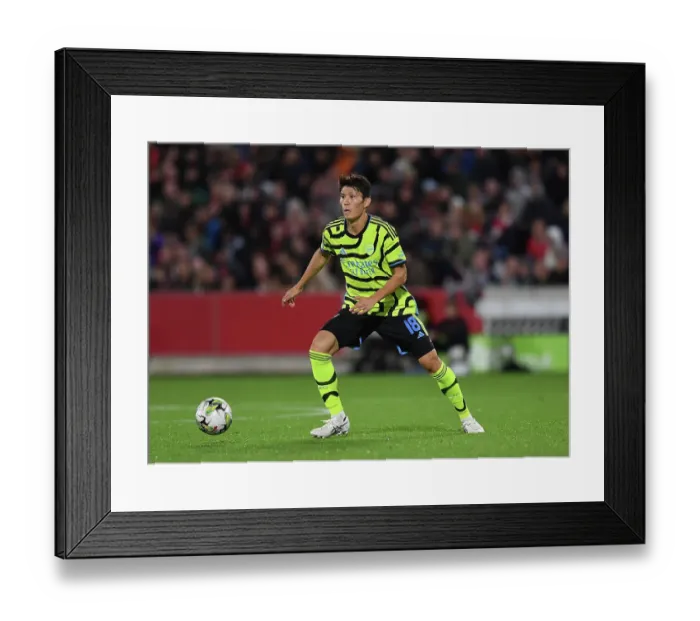 Framed Print : Tomiyasu's Star Performance: Arsenal Overpower Brentford in Carabao Cup
