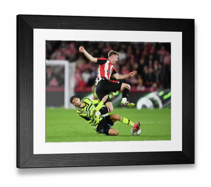 Framed Print : Brentford vs. Arsenal: Clash Between Kai Havertz and Nathan Collins in the Carabao Cup Framed Print : Brentford vs. Arsenal: Clash Between Kai Havertz and Nathan Collins in the Carabao Cup