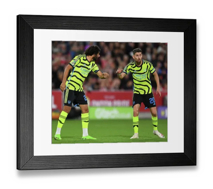 Framed Print : Arsenal Players Mohamed Elneny and Jorginho Strategize during Brentford vs Arsenal Carabao Cup Match, 2023-24