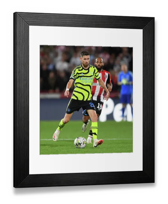 Framed Print : Jorginho in Action: Arsenal's Midfield Maestro Shines in Carabao Cup Clash Against Brentford