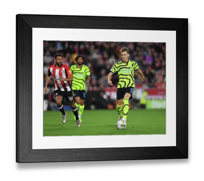 Framed Print : Arsenal's Martin Odegaard Shines in Carabao Cup Clash Against Brentford Framed Print : Arsenal's Martin Odegaard Shines in Carabao Cup Clash Against Brentford