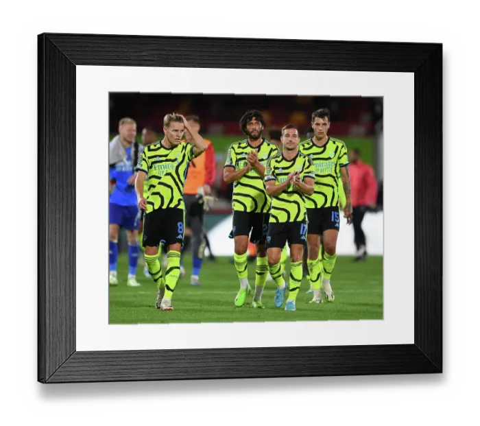 Framed Print : Arsenal Triumph in Carabao Cup Clash against Brentford: Odegaard, Elneny, and Soares Celebrate