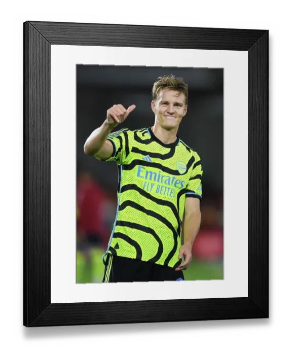 Framed Print : Arsenal's Martin Odegaard Acknowledges Fans after Brentford Cup Victory (2023-24) Framed Print : Arsenal's Martin Odegaard Acknowledges Fans after Brentford Cup Victory (2023-24)