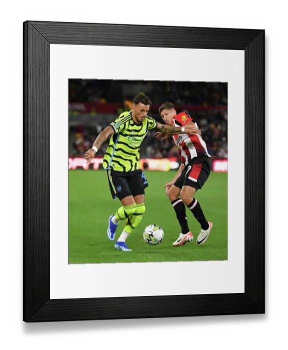 Framed Print : Brentford vs Arsenal: Carabao Cup Clash - White vs Janelt Battle