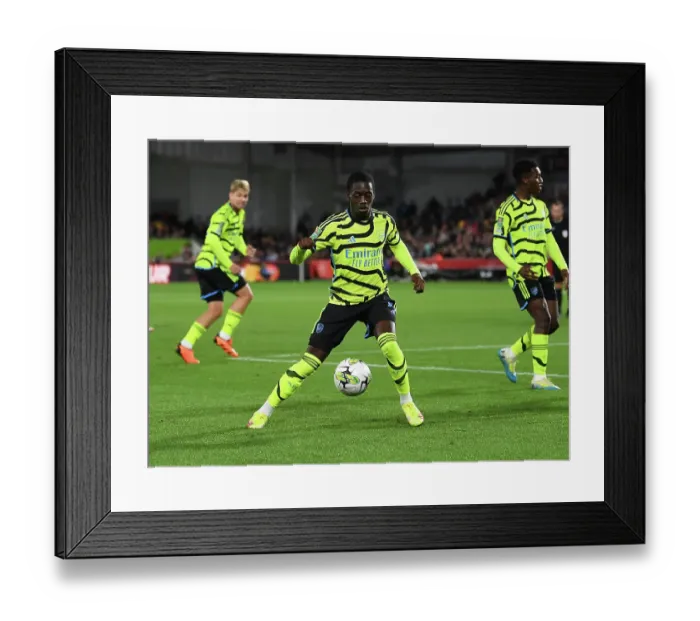 Framed Print : Charles Sagoe Jr's Brilliant Performance: Arsenal Triumph Over Brentford in Carabao Cup