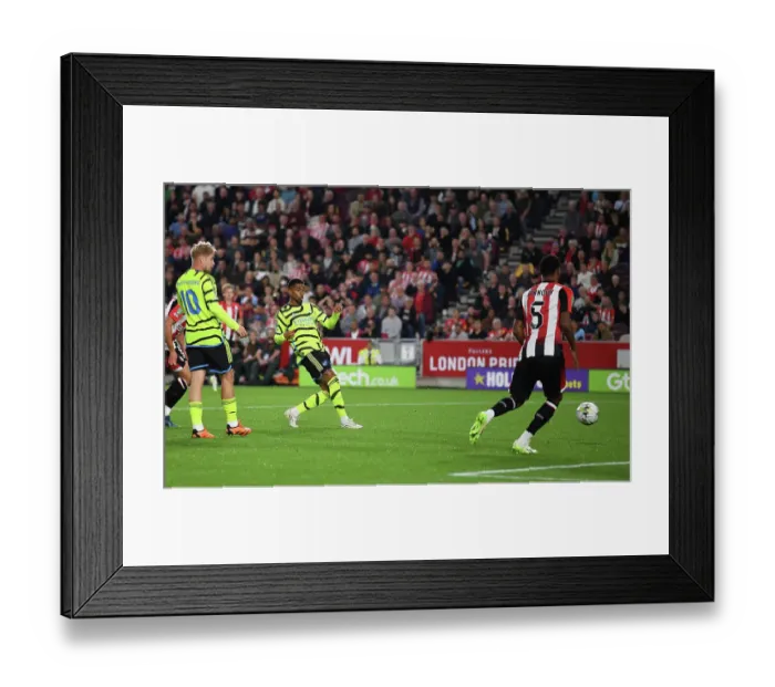 Framed Print : Reiss Nelson Scores the Shocking Upset: Arsenal's Victory over Brentford in Carabao Cup Third Round