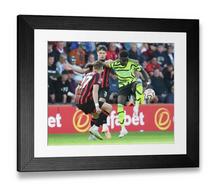 Framed Print : Bukayo Saka Faces Off Against Milos Kerkez in AFC Bournemouth vs Arsenal FC Premier League Clash (2023-24) Framed Print : Bukayo Saka Faces Off Against Milos Kerkez in AFC Bournemouth vs Arsenal FC Premier League Clash (2023-24)