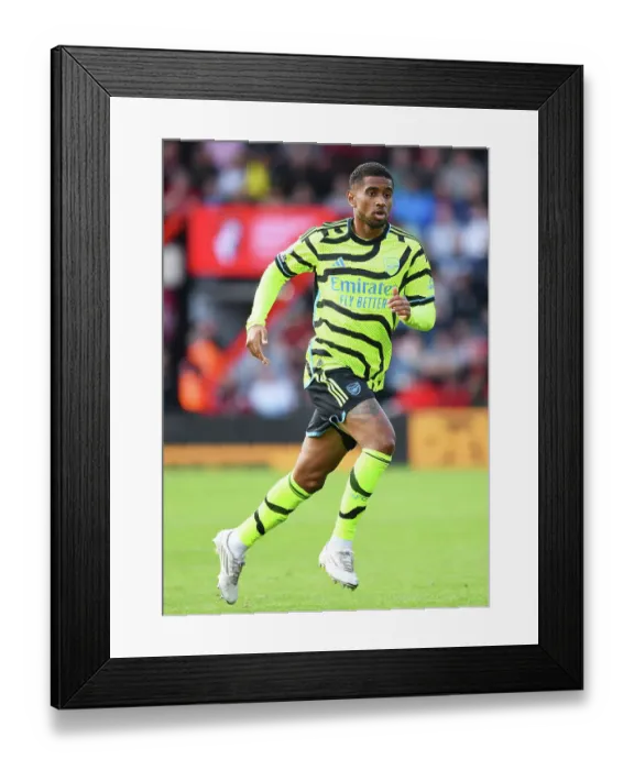 Framed Print : Arsenal's Reiss Nelson Focuses Ahead Amidst AFC Bournemouth Battle (2023-24 Premier League)