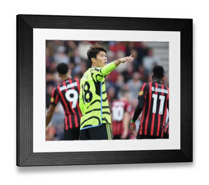 Framed Print : Arsenal's Tomiyasu Faces Off Against AFC Bournemouth in Premier League Showdown (2023-24)