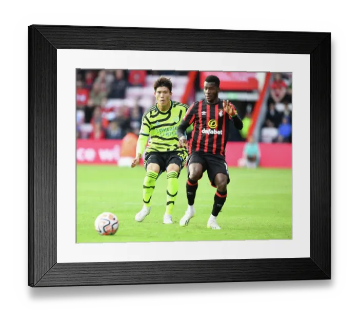 Framed Print : Arsenal's Tomiyasu Pressures Ouattara in AFC Bournemouth Clash (2023-24 Premier League) Framed Print : Arsenal's Tomiyasu Pressures Ouattara in AFC Bournemouth Clash (2023-24 Premier League)