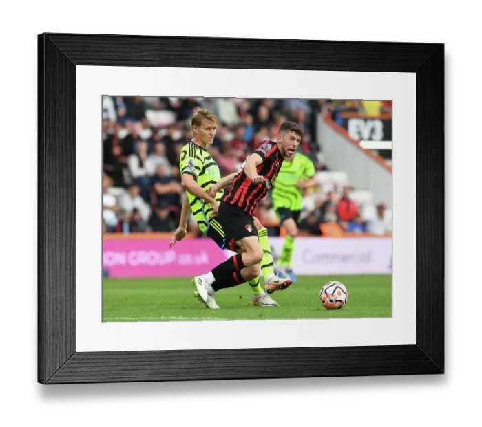 Framed Print : Arsenal vs. AFC Bournemouth: Martin Ødegaard Clashes with Ryan Christie in Premier League Showdown (2023-24)