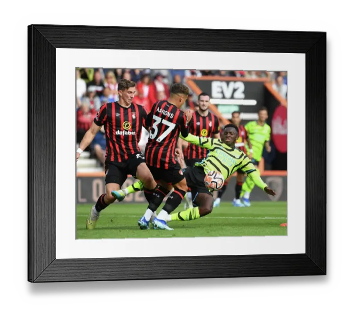 Framed Print : Clash at the Vitality: Arsenal's Nketiah Faces Off Against Aarons in Premier League Showdown (AFC Bournemouth vs Arsenal, 2023-24)