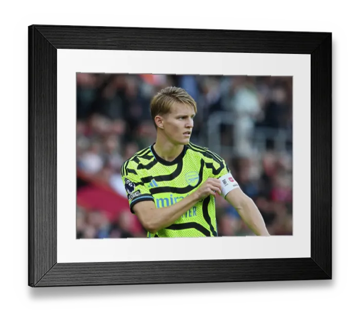 Framed Print : Arsenal's Odegaard Adjusts Captain's Armband in AFC Bournemouth Clash (2023-24)