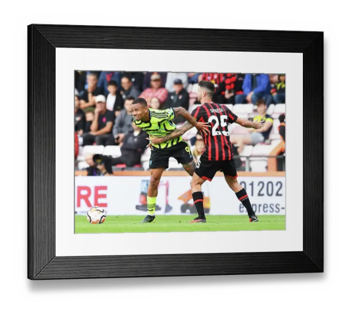 Framed Print : Gabriel Jesus vs Marcos Senesi: Intense Battle in AFC Bournemouth vs Arsenal FC, Premier League 2023-24