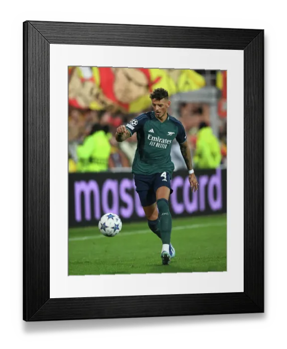 Framed Print : Arsenal's Ben White in Action against RC Lens in 2023-24 UEFA Champions League Framed Print : Arsenal's Ben White in Action against RC Lens in 2023-24 UEFA Champions League