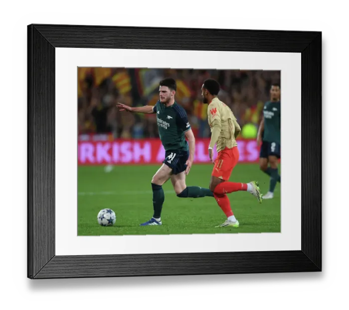 Framed Print : Arsenal's Declan Rice Clashes with Angelo Fulgini in RC Lens Champions League Showdown