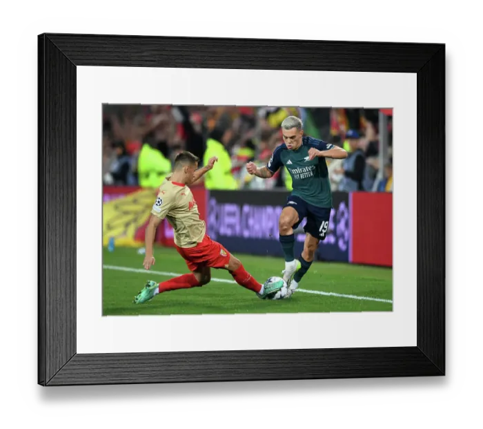 Framed Print : Champions League Showdown: Trossard vs. Frankowski - A Clash of Wings: Arsenal's Trossard Faces Off Against RC Lens Frankowski