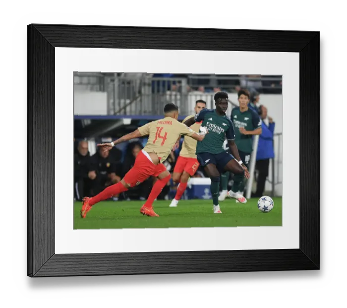 Framed Print : Bukayo Saka Faces Off Against RC Lens: Arsenal's Champions League Battle