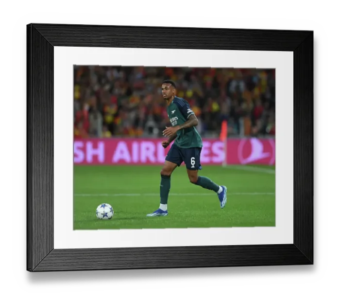 Framed Print : Arsenal's Gabriel Magalhaes in Action: RC Lens vs Arsenal, UEFA Champions League 2023-24 Framed Print : Arsenal's Gabriel Magalhaes in Action: RC Lens vs Arsenal, UEFA Champions League 2023-24