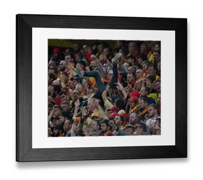Framed Print : RC Lens vs. Arsenal: Thrilling Champions League Clash with Fan Surfing Euphoria