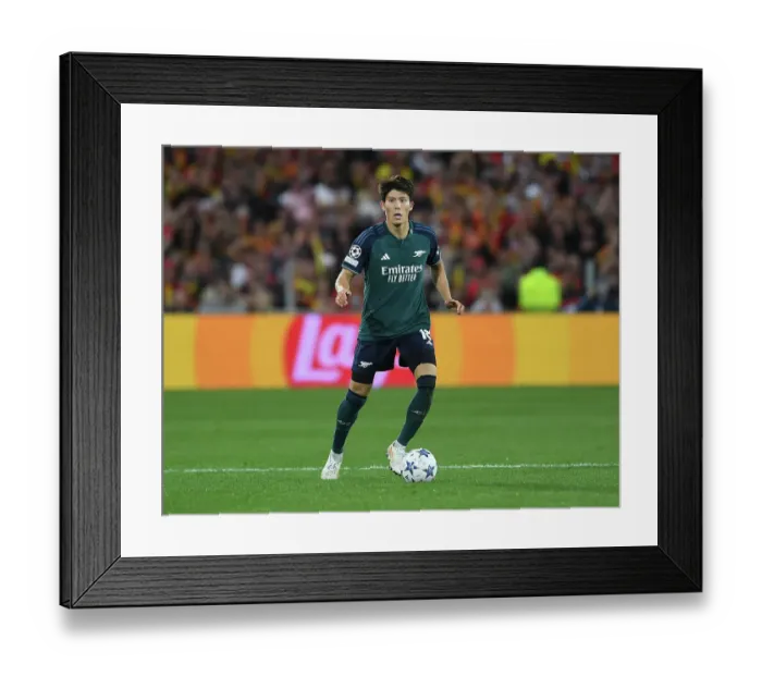 Framed Print : Champions League: Arsenal's Tomiyasu Shines Against RC Lens in Group B