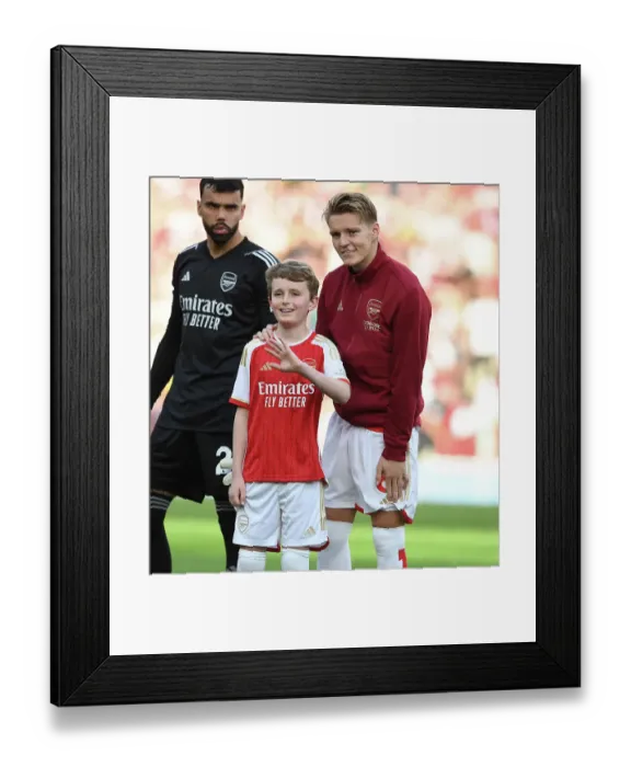 Framed Print : United Before Battle: Martin Odegaard and Arsenal Mascot, 2023-24: Arsenal vs Manchester City Framed Print : United Before Battle: Martin Odegaard and Arsenal Mascot, 2023-24: Arsenal vs Manchester City