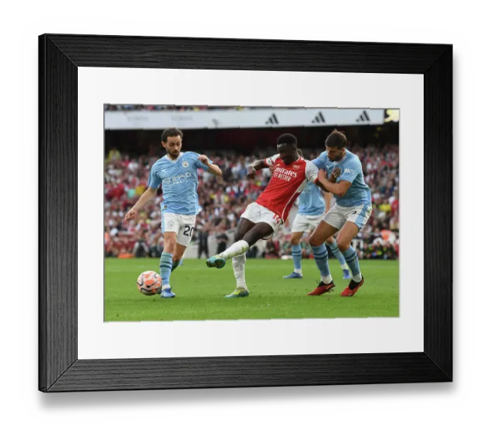Framed Print : Arsenal vs Manchester City: Intense Battle – Nketiah Evades Pressure Framed Print : Arsenal vs Manchester City: Intense Battle – Nketiah Evades Pressure