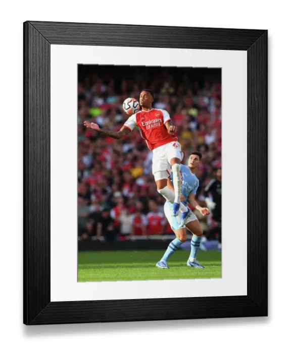 Framed Print : Arsenal vs Manchester City: Gabriel Faces Off Against Alvarez in Intense Premier League Clash (2023-24)