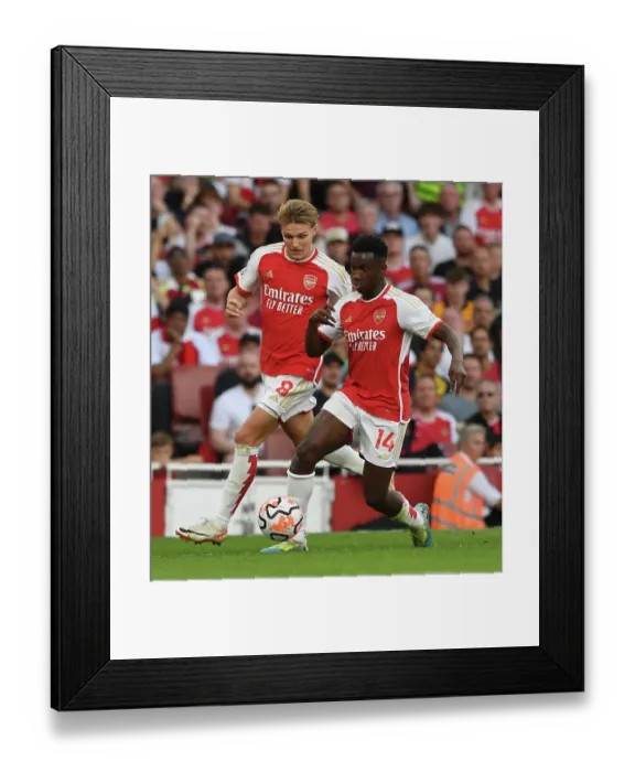 Framed Print : Arsenal's Nketiah and Odegaard Face Off Against Manchester City in 2023-24 Premier League