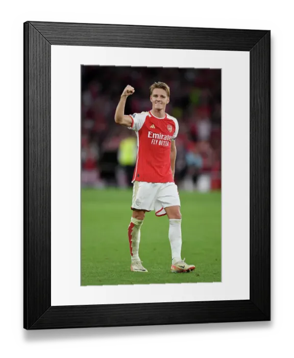 Framed Print : Martin Odegaard's Emotional Victory Celebration: Arsenal Triumph Over Manchester City (2023-24 Premier League)