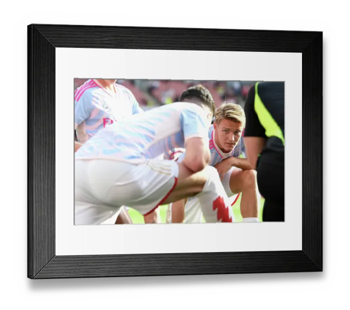 Framed Print : Arsenal vs Manchester City: Martin Odegaard Warms Up Ahead of 2023-24 Premier League Clash