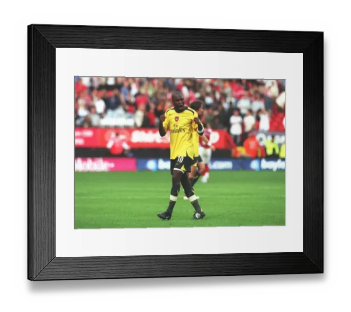Framed Print : Arsenal defender William Gallas celebrates after the match Framed Print : Arsenal defender William Gallas celebrates after the match