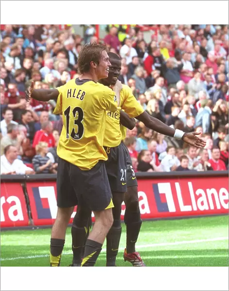 Emmanuel Eboue and Alex Hleb (Arsenal) celebrate the 2nd Robin van Persie goal