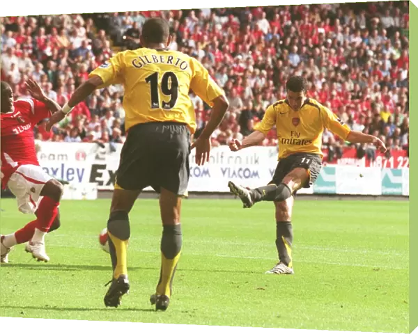 Robin van Persie shoots past Scott Carson to score the 1st Arsenal goal