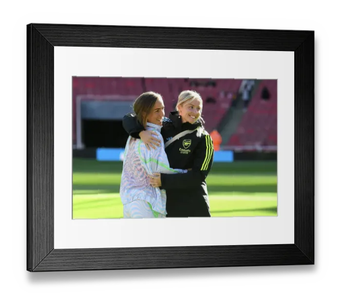 Framed Print : Arsenal Women's Team: Lia Waelti and Leah Williamson Embrace Ahead of Arsenal v Aston Villa (2023-24)