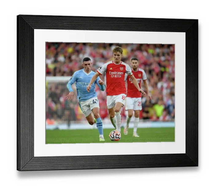 Framed Print : Arsenal's Odegaard Faces Off Against Manchester City's Foden in Premier League Showdown (2023-24) Framed Print : Arsenal's Odegaard Faces Off Against Manchester City's Foden in Premier League Showdown (2023-24)