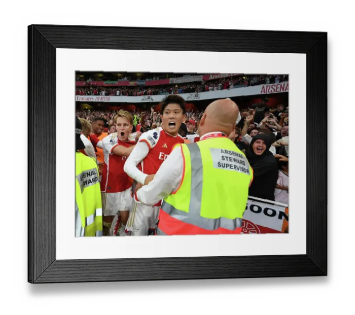 Framed Print : Arsenal's Martin Odegaard and Takehiro Tomiyasu Celebrate Gabriel Martinelli's Goal Against Manchester City (2023-24)
