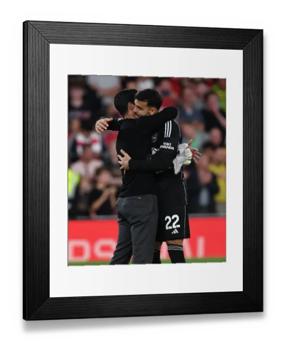 Framed Print : Arsenal's Victory: Mikel Arteta Celebrates with David Raya after Beating Manchester City (2023-24)