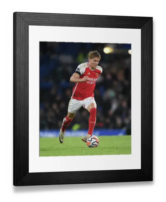 Framed Print : Martin Odegaard Faces Off Against Chelsea in the 2023-24 Premier League Clash